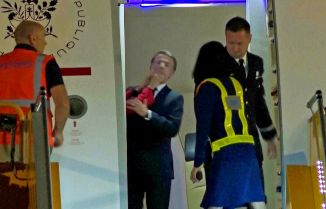 Watch: French First Lady Caught Shoving President Macron’s Face on Aircraft He Finally Speaks Out